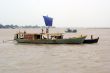 Motor boat with sail
