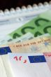 Money with euro signs and calendar
