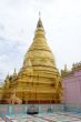 Golden stupa and pink wall