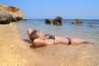 model lying on the beach