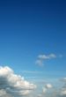 fluffy cloud on bright blue sky