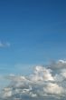 fluffy cloud on bright blue sky