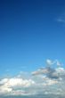 fluffy cloud on bright blue sky