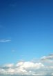 fluffy cloud on bright blue sky