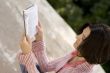 female reading in park