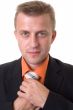 businessman with beard adjusting his tie