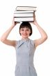 Thick books on the head.