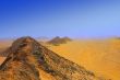 mountains and yellow sand in desert in mist