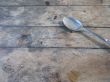 metal dirty spoon on a table