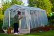Man Painting Greenhouse