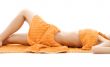 torso of relaxed lady with orange towels