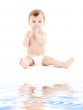 baby boy in diaper with toothbrush