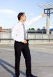 businessman in a front of a building site