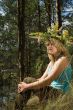 Young beautiful woman in a summer wood