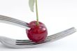 wet cherry with two fork