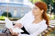 businesswoman with laptop in the park