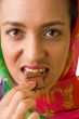 woman eats chocolate