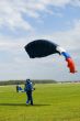 Landing of the sportsman after parachute jump