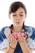 Cute girl blowing petals