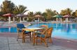 Three arm-chair near swimming pool.