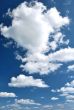 day blue sky with white fluffy clouds