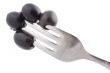 black olive on fork