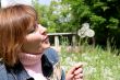 woman and dandelion