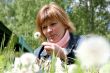 woman and dandelion