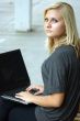 Young, blonde girl with laptop