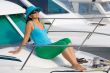 beautiful woman aboard a yacht sunbathing