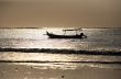Drifting boat on a sunset