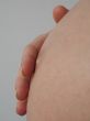 hand on a pregnant belly