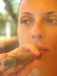 woman smoking a cigar