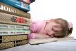 girl sleep under book