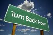 Turn Back Now Road Sign