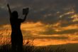 female praying with bible