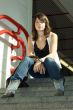 Young girls, young woman sitting on a staircase.