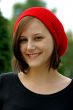 Portrait of a young girl with red cap.