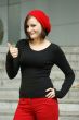 Girls with red cap stretches thumb in the air