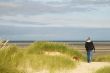 Walking the dog near the beach