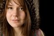 serious young woman in fur hat