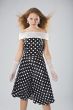 serious woman in black and white dress