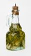 Bottle of olive oil with spice green herbs