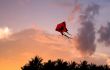 Kite flying at sunset