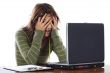 Beautiful frightened girl with laptop