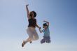 Mother and son jumping