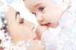 happy mother playing with baby boy