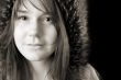 serious young woman in fur hat