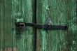 Lock on a wooden green door