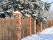 wooden fence with snow